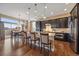 Gourmet kitchen with granite countertops, a center island, dark wood cabinets and stainless steel appliances at 7635 Weaver Cir, Castle Rock, CO 80104