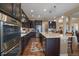 Well-appointed kitchen with ample cabinet space, stainless steel appliances, and an island with seating for casual dining at 7635 Weaver Cir, Castle Rock, CO 80104