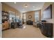 Cozy home office with neutral carpet, a desk, chair, piano, and natural light from several windows at 7635 Weaver Cir, Castle Rock, CO 80104