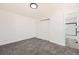 Cozy bedroom with neutral carpet, a closet, and a view to the bathroom at 1537 Xenia St, Denver, CO 80220