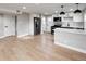 Open kitchen featuring a stainless steel refrigerator, white cabinets and countertops at 1568 Verbena St, Denver, CO 80220