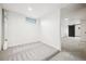Finished basement area with plush carpeting and one small window for natural light at 3196 S Logan St, Englewood, CO 80113
