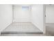 Finished basement with carpet, neutral walls, and natural light from one small window at 3196 S Logan St, Englewood, CO 80113