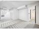 Spacious basement featuring neutral carpet, bright white walls, and an attached bathroom at 3196 S Logan St, Englewood, CO 80113