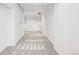 Finished basement area with plush carpeting and freshly painted white walls at 3196 S Logan St, Englewood, CO 80113