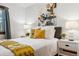 Cozy bedroom with a stylish mustard colored throw, hardwood floors, and contemporary decor at 3196 S Logan St, Englewood, CO 80113