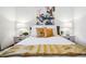 Inviting bedroom with stylish decor, hardwood floors, and plush bedding for a comfortable night's sleep at 3196 S Logan St, Englewood, CO 80113