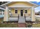 Charming home with a welcoming front porch, neat landscaping, and inviting curb appeal at 3196 S Logan St, Englewood, CO 80113