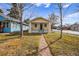 Charming home exterior with a welcoming front porch and walkway at 3196 S Logan St, Englewood, CO 80113