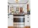 Stylish kitchen featuring modern stove and a view of the living room at 3196 S Logan St, Englewood, CO 80113