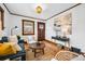 Cozy living room featuring hardwood floors, stylish furnishings, and bright natural light at 3196 S Logan St, Englewood, CO 80113