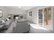 Spacious basement with a brick fireplace and sliding glass door to the outside at 7852 S Logan St, Littleton, CO 80122