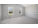 Spacious bedroom with neutral walls, carpet, and windows allowing lots of natural light at 7852 S Logan St, Littleton, CO 80122
