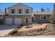Charming two-story home with a brick and siding exterior, a two-car garage, and a well-maintained front yard at 7852 S Logan St, Littleton, CO 80122