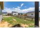 Large backyard with a wood fence, offering a private outdoor space at 9862 Reunion Pkwy, Commerce City, CO 80022