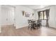 Cozy dining area with modern table, chairs, contemporary light fixture, and neutral decor at 9862 Reunion Pkwy, Commerce City, CO 80022