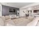 Stylish living area featuring a dark accent wall, modern decor, and an open layout at 9862 Reunion Pkwy, Commerce City, CO 80022