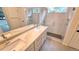 Modern bathroom with a double vanity, sleek fixtures, and a glass-enclosed shower at 10538 Tiger Chase, Lone Tree, CO 80124