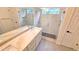 Modern bathroom with double vanity sinks, quartz countertops, and glass enclosed shower at 10538 Tiger Chase, Lone Tree, CO 80124