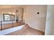 Bright living room featuring vaulted ceilings, with wood floors and open staircase at 10538 Tiger Chase, Lone Tree, CO 80124