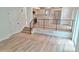 Spacious living room features light floors, staircase, and a glimpse into the kitchen at 10538 Tiger Chase, Lone Tree, CO 80124