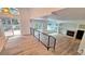 Open-concept living space with a fireplace, deck access, and bright windows at 10538 Tiger Chase, Lone Tree, CO 80124