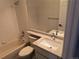 Bathroom featuring a tub with shower and single sink vanity with decorative countertops at 10538 Tiger, Lone Tree, CO 80124