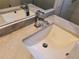 Bright bathroom sink with marble countertop, chrome faucet, and white basin at 10538 Tiger, Lone Tree, CO 80124