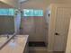 Beautiful bathroom showcasing tiled glass shower, modern fixtures, and vanity with stone countertop at 10538 Tiger, Lone Tree, CO 80124