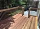 A newly constructed, light-wood deck with railings and space for entertaining or relaxing at 10538 Tiger, Lone Tree, CO 80124