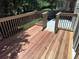Spacious back deck with wood flooring and railings, perfect for outdoor entertaining at 10538 Tiger, Lone Tree, CO 80124