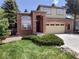Charming two-story home with a brick facade, arched entryway, and well-maintained landscaping at 10538 Tiger, Lone Tree, CO 80124