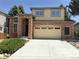 Charming two-story home featuring a brick facade, two-car garage, and well-maintained landscaping at 10538 Tiger, Lone Tree, CO 80124