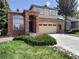 Charming two-story home featuring a brick facade, two-car garage, and well-maintained landscaping at 10538 Tiger, Lone Tree, CO 80124