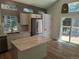 Modern kitchen featuring stainless steel appliances, granite countertops, a center island, and lots of natural light at 10538 Tiger, Lone Tree, CO 80124