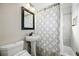 Cozy bathroom with a pedestal sink, updated fixtures, and shower-tub combination at 1730 W 51St Ave, Denver, CO 80221