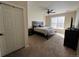 Serene bedroom featuring carpet flooring, a ceiling fan, and a cozy bed setup at 14201 E 1St Dr # 104, Aurora, CO 80011