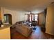 Spacious living room featuring hardwood floors and a cozy seating arrangement at 14201 E 1St Dr # 104, Aurora, CO 80011