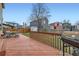 Backyard view of a wood deck and a grill surrounded by a wood fence and other homes at 19372 E 41St Ave, Denver, CO 80249