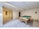 Finished basement offering a billiard room with a pool table and carpet flooring at 19372 E 41St Ave, Denver, CO 80249