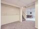 Finished basement with carpet flooring and potential storage space located next to the stairs at 19372 E 41St Ave, Denver, CO 80249