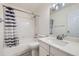 Bathroom with a shower and tub combination, sink, toilet, and large mirror at 19372 E 41St Ave, Denver, CO 80249