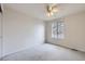 Bedroom with carpet, window, ceiling fan, and view to the outdoors at 19372 E 41St Ave, Denver, CO 80249