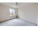 Bedroom with carpet, window, ceiling fan and a stuffed animal by the window at 19372 E 41St Ave, Denver, CO 80249