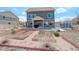 Rear exterior showcasing the home's architecture and design, complemented by the landscaped backyard at 4971 Ceylon Way, Denver, CO 80249