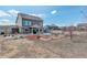 Spacious backyard featuring garden beds and ample space for outdoor activities at 4971 Ceylon Way, Denver, CO 80249