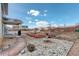 Well-maintained backyard featuring beautiful landscaping, rock beds, and a lush lawn at 4971 Ceylon Way, Denver, CO 80249