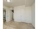 Empty bedroom offering versatility, with ensuite bathroom, storage, and neutral colors at 4971 Ceylon Way, Denver, CO 80249