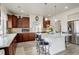 Kitchen featuring stainless steel appliances, a central island with seating, and plenty of counter space at 4971 Ceylon Way, Denver, CO 80249