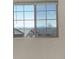 Bright window with mountain views brings natural light into the room at 4971 Ceylon Way, Denver, CO 80249